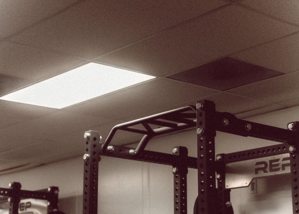 Bright modern gym interior with training equipment and open space