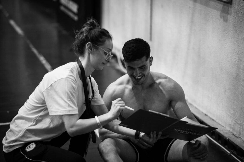 Trainer discussing workout plan with prospective client